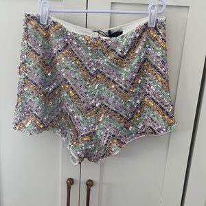 Fully lined sequined shorts.